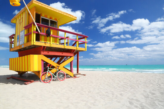 Modern bike & lifeguard station on the huge beach of Miami Beach. No people.