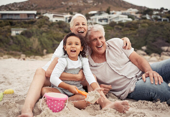 Family, time and beach with grandparents and grandchild laugh and play in sand, sitting and bonding in nature. Portrait of a happy girl enjoying seaside trip with senior man and woman, relax and fun - obrazy, fototapety, plakaty