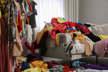 Mess of clothes all over room. Fast fashion