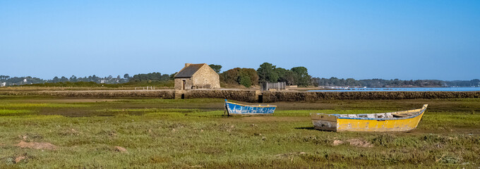 Arz island in the Morbihan gulf, the tide mill, with typical row boats, panorama

