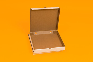 pizza box open on yellow background