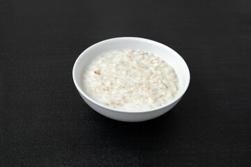 Portion of oatmeal - dark background