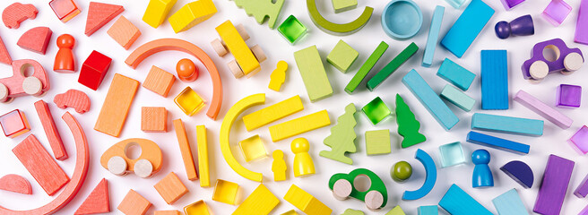 Colorful abstract background with wooden toys. Educational games for Colors sorting. Rainbow...