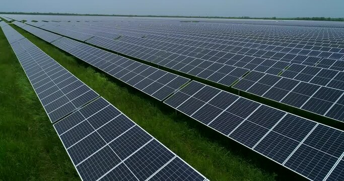 Drone footage. Flight over solar panel farm. Renewable green alternative energy. 4K Mexico
