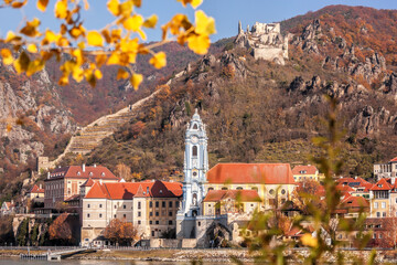 Panorama of Duernstein village with church and castle during autumn in Wachau valley, Austria,...