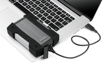 External USB hard drive isolated on white background. Waterproof protected external hard drive. Hard disk for connecting to a laptop, transferring data between a computer and a hard disk.