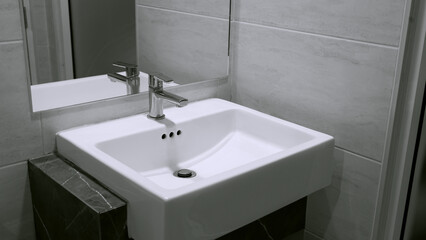 Interior of clean toilet white sink interior of toilet with of washing hands and mirror
