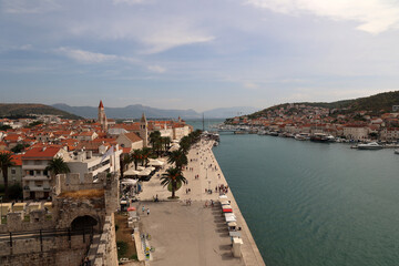 Sunny promenade along the pier of the old Venetian town of Trogir, Croatia