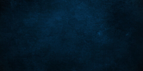 Dark Blue background with grunge backdrop texture, watercolor painted mottled blue background, colorful bright ink and watercolor textures on black paper background.