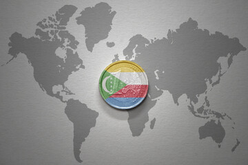 euro coin with national flag of comoros on the gray world map background.3d illustration.