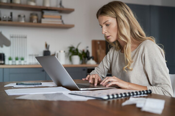 Focus caucasian woman working at home