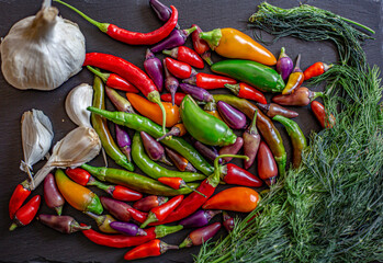 Time for a fiery pickle.Colorful chili peppers and spices. Assortment of fresh and dryed peppers:...