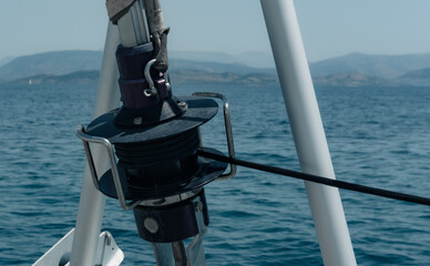 Genoa sail furling equipment, ropes,  sea view from front catamaran