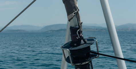 Genoa sail furling equipment, ropes,  sea view from front catamaran