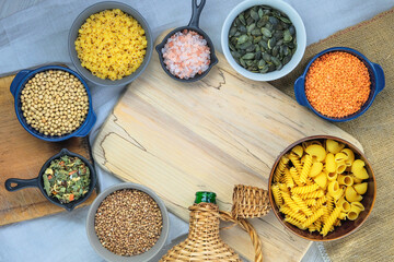 Various vegetarian organic products in bowls. Rural view. Top view. Copy space.