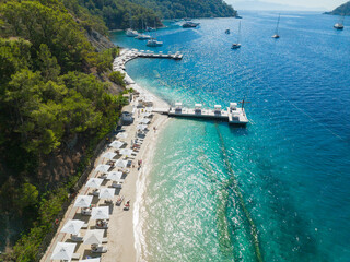 Turquoise Sea and White Umbrellas Drone Photo, Gocek Beach Fethiye, Mugla Turkey