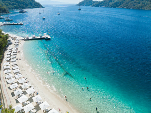 Turquoise Sea and White Umbrellas Drone Photo, Gocek Beach Fethiye, Mugla Turkey
