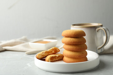 Tasty shortbread cookies with filling on light grey marble table