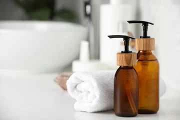 Tuinposter Different personal care products on countertop in bathroom, closeup. Space for text © New Africa