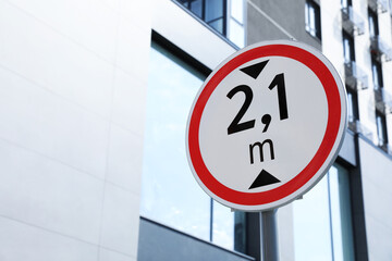 Traffic sign Height limit near modern building