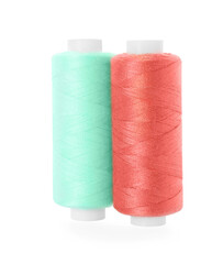 Different colorful sewing threads on white background
