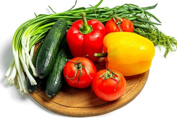 Fototapeta na wymiar Fresh ripe vegetables and herbs on a wooden kitchen board
