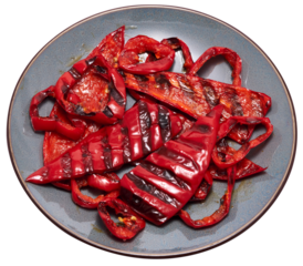 Grilled Slices of red pepper with stripes from a grill in ceramic plate