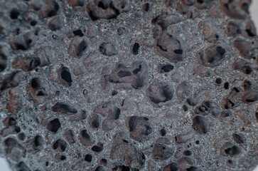 Volcanic stone, hardened porous lava. Close-up photo of stone
