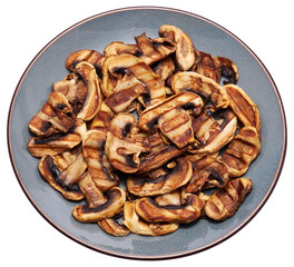 Grilled Slices of champignon mushrooms with stripes from a grill in ceramic plate