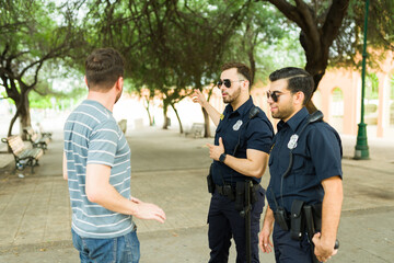 Lost caucasian man getting helpful information from the police