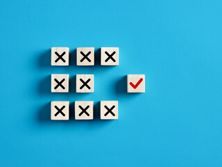 Checkmark and cross icons on wooden cubes. Separate the right from wrong, right choice or decision,...