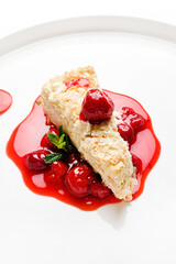 napoleon cake with cherry sauce and mint
