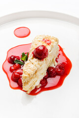 napoleon cake with cherry sauce and mint