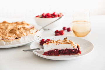 Plate with tasty cherry pie on white background. Top view. Front view