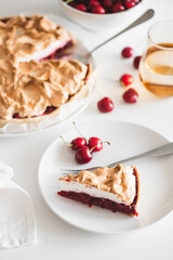 Plate with tasty cherry pie on white background. Top view. Front view