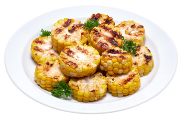 Grilled Slices of corn cobs with stripes from a grill in ceramic plate