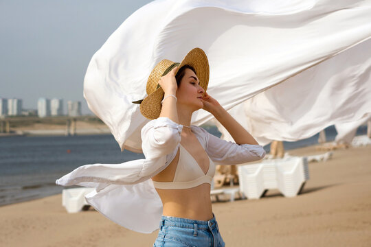 Caucasian girl on beach windy day