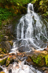 Fototapeta premium Teufelsbach Wasserfall in Silbertal, Bezirk Bludenz in Vorarlberg (Österreich)
