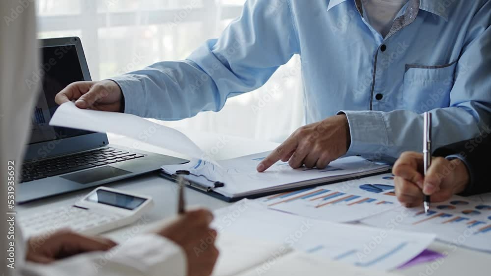 Poster business people pointing graph and using calculator during business meeting. business team meeting a