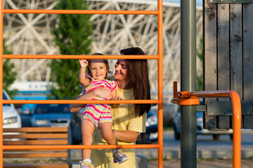 Obraz premium Toddler girl and mom. Family walk