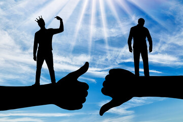 Selfishness and ego. An arrogant selfish man with a crown on his head, considering himself better than the other person.