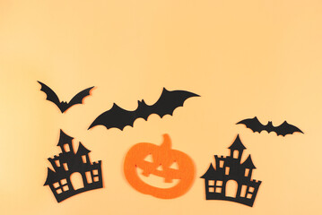decorations for Halloween holiday, Halloween pumpkins, castles and bats on orange color background.