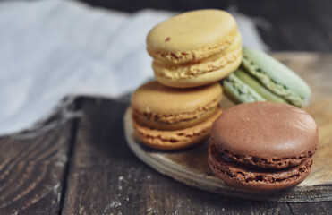 
Sweet macaroons on wooden Table Background
