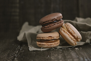 
Sweet macaroons on wooden Table Background
