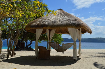 Relaxing by tropical white sand beach