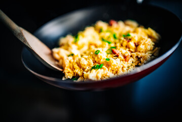 cooking tasty scrambled eggs in frying pan