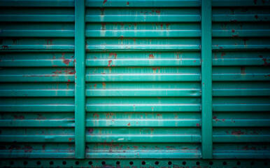 iron background - wall of an old rusty freight car, green color