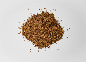 Buckwheat on a white background. Buckwheat texture close up.