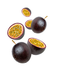 Purple passion fruit with half sliced levitate isolated on white background.