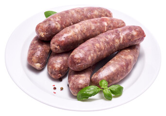 Raw beef or pork grill sausage on ceramic plate isolated